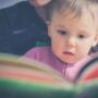 Reads Book to a Young Child for Early Learning