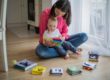 Kid's Creek Therapy - child and mother playing together with multicolored fabric toys